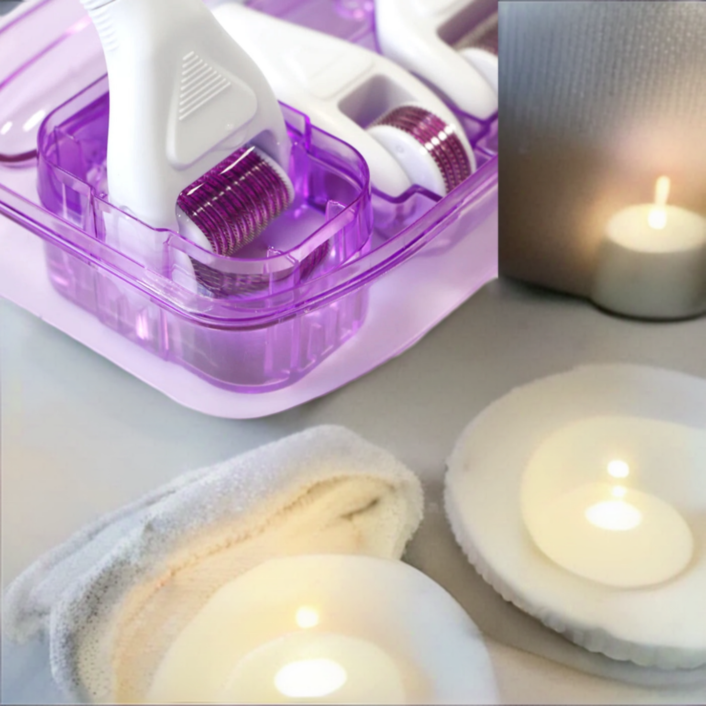 Close-up of 6 In 1 Derma Roller System next to candles on an elegant table.