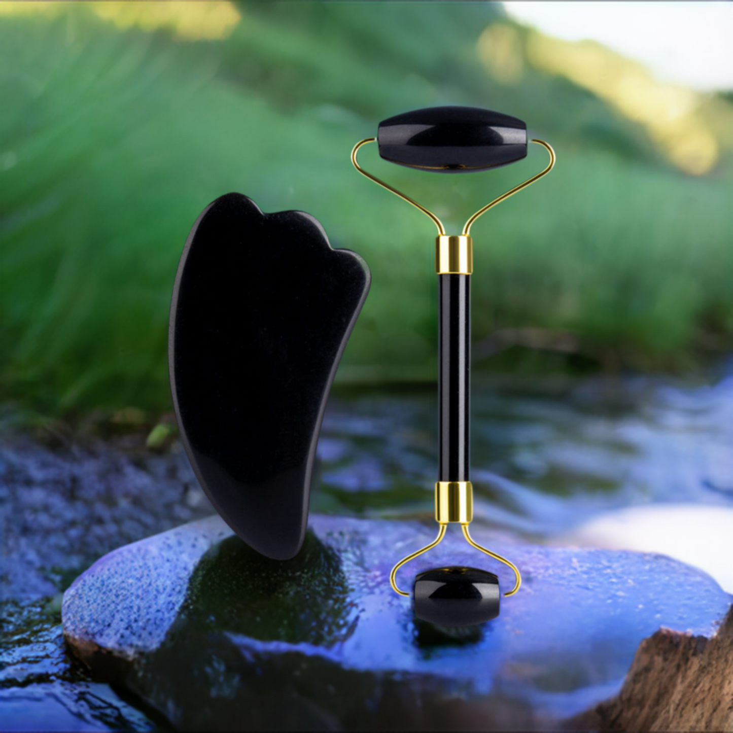 Premium Obsidian Jade Roller with Gua Sha on a wet rock next to a stream and green grass.