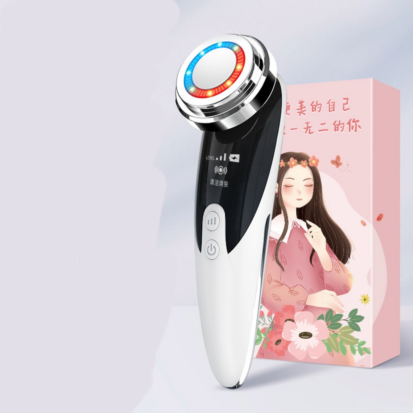 White facial massage cleaner next to box with Asian writing and woman against a white background.